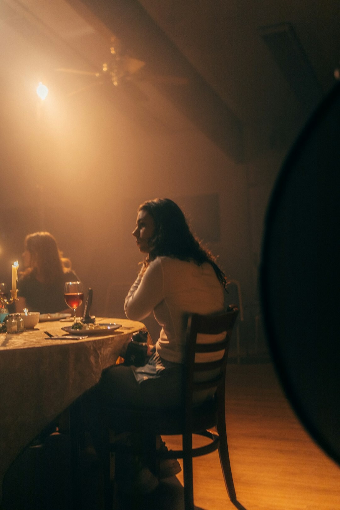 Editorial team meeting around a table discussing a story